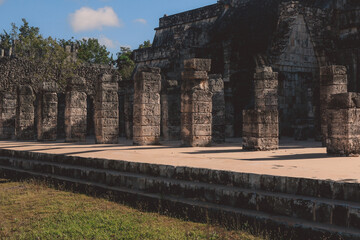 Fototapeta na wymiar Remains of an Ancient Ruins of the large pre-Columbian city Chichen Itza, built by the Maya people, Mexico
