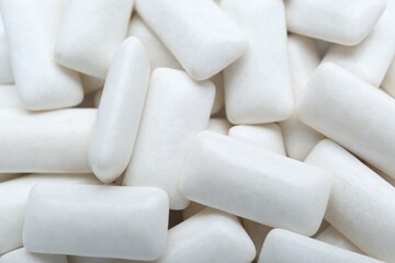 Fototapeta na wymiar Tasty white chewing gums as background, top view