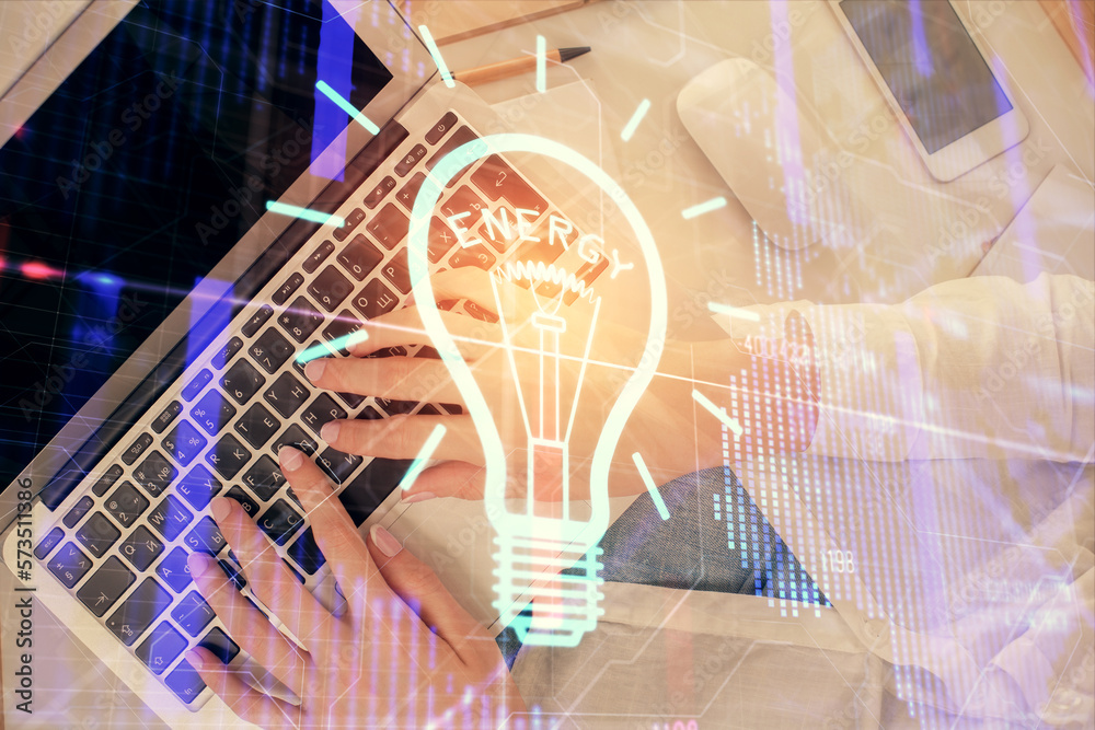 Poster double exposure of woman hands working on computer and light bulb hologram drawing. top view. idea c