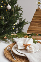 Luxury place setting with beautiful festive decor for Christmas dinner on white table