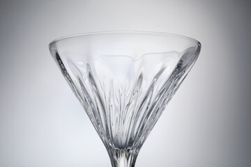 Elegant empty martini glass on grey background, closeup