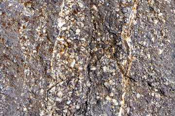 Rock, stone, textured. Background for design. Stones texture nature photo. Rock background. Mountain close-up. Mountain texture. High quality photo.
