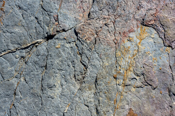 Rock, stone, textured. Background for design. Stones texture nature photo. Rock background. Mountain close-up. Mountain texture. High quality photo.