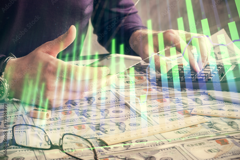 Aufkleber double exposure of man's hands holding and using a digital device and forex graph drawing. financial