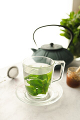 Tea with fresh mint leaves. Mint infusion helps with digestive problems