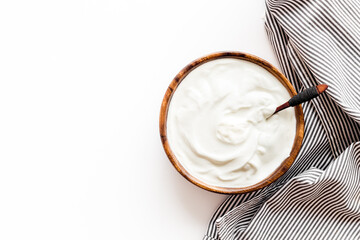 Bowl of sour cream or yogurt. Dairy product background