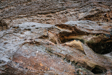 textured closeup of a rock cliff wall