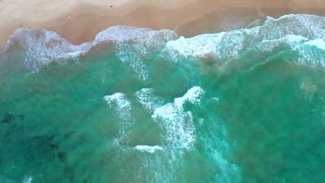 Moving to the left aerial top down drone shot of the beach and ocean riptide currents at Bondi beach Australia