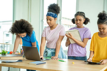 African american elementary school children using digital tablet computer learning online education...