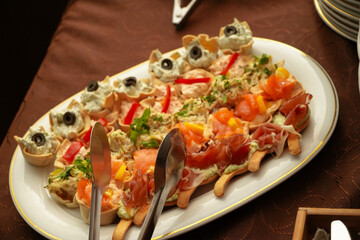 appetizers. platters of appetizers placed on a table at an event.