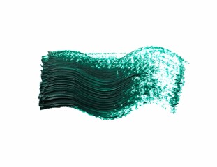 Dark green oil paint stroke on white background, top view
