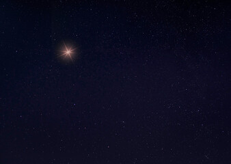 Obraz na płótnie Canvas Bright light in the sky on a starry night