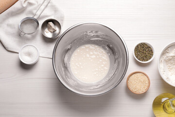 Cooking grissini. Different ingredients on white wooden table, flat lay