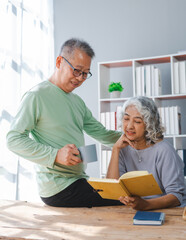 Fototapeta premium Elderly couple asian people grandfather and grandmother living together in retirement Concept of elderly health and health insurance.