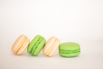 white and green macaroons isolated on white background, free copy space
