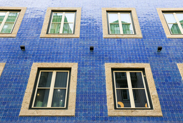 Typical vintage portuguese facade with white windows