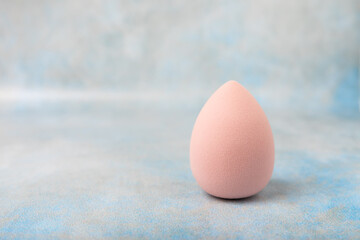 Beauty blender. Colorful beauty sponges on a marble background. Cosmetic tool for applying foundation, concealer. Place for text. Place to copy.