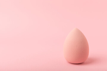 Beauty blender. Colorful beauty sponges on a pink background. Cosmetic tool for applying foundation, concealer. Place for text. Place to copy.
