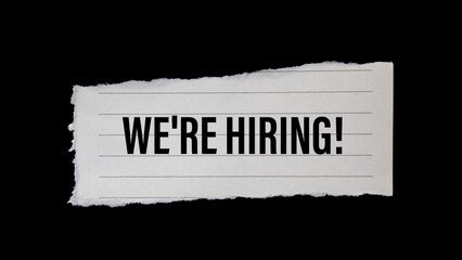 We're hiring! written on ripped paper. Business concept photo.