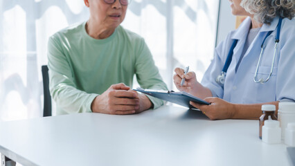 Elderly medical asian people with patient, Physical check-ups and encouragement for treatment of rheumatism and cancer The concept of health insurance for the elderly and health care