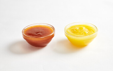 chilli sauce and yellow mustard isolated on white background
