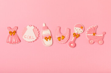 IT'S A GIRL! Baby shower cookies on a bright pink background. Gender cookies. Candy bar holiday baby shower party. Gender party. Holiday concept.