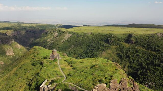 Aerial view over the Vahramashen Church and famous Amberd fortress on the slope of Mount Aragats in Armenia. Travel attractions  in Armenia.
