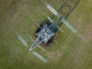 Bird's Eye View of Industrial High Voltage Lattice Power Line Tower