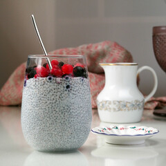 Vegetal Milk Chia Seed Pudding in the glass on a light background.