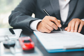 Car dealer business woman signing car insurance document or lease paper. Planning to manage transportation finance costs. Concept of car insurance business, saving buy with tax and loan for new car. - obrazy, fototapety, plakaty