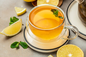 Bergamot tea in transparent cup with fresh bergamot fruit, Clean eating, dieting, vegan food concept. top view