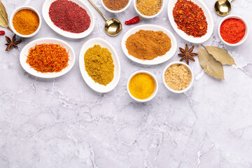 Various dried spices in small bowls
