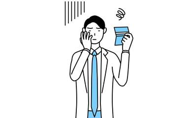 預金通帳を見て落ち込む白衣を着た男性医師