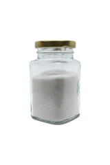Salt in a glass jar with closed lid. Isolated on white with clipping path.