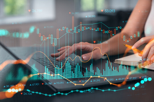 Woman typing on laptop at office workplace in background. Concept of working process, internet surfing, online business education. Student send e-mail. Close up view. forex graph and charts