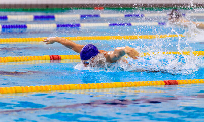 man athlete swim butterfly stroke in swimming competition