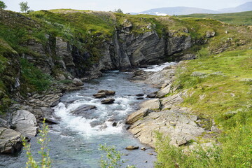 Naklejka na ściany i meble River in Swedish mountain area with some rapids and flowing in smaller canyon 