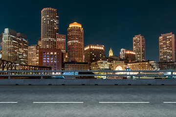 Empty urban asphalt road exterior with city buildings background. New modern highway concrete construction. Concept of way to success. Transportation logistic industry fast delivery. Boston. USA.