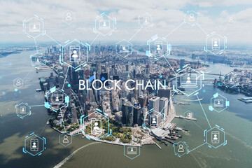 Aerial panoramic helicopter city view on Lower Manhattan district and financial Downtown, New York, USA. Decentralized economy. Blockchain, cryptography and cryptocurrency concept, hologram