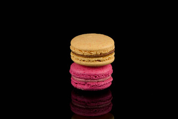 Colorful macaroon over black background