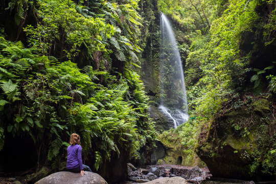 A young woman in Tilos waterfall, La Palma Island, Canary Islands.