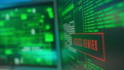Computer screen with green lines of program codes and red window with access denied warning. Access granted. Computer virus attack, cybercrime, computer hacking attack concept.