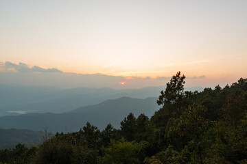 Beautiful landscape sunset seen from Kiewlom viewpoint, the highest campground in Thailand, at Doi Pha Hom Pok National Park, Fang District, Chiang Mai, Thailand.