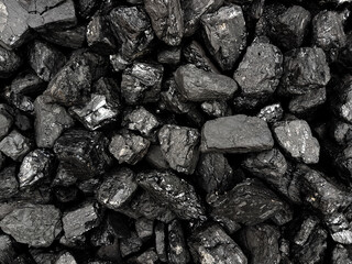 Natural black coals background texture. Top view of fuel for industrial coal