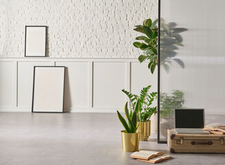 Modern home furniture design, gold vase of plant, retro old baggage and laptop style, white brick and classic wall background frame.