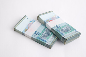 Malaysia Currency Ringgit 50: Stack of Ringgit Malaysia bank note on white background