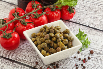 Marinated green capers in the bowl