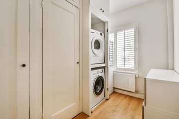 Interior of laundry room with washing machine