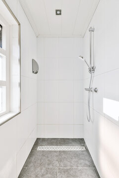 Interior of modern bathroom with shower zone