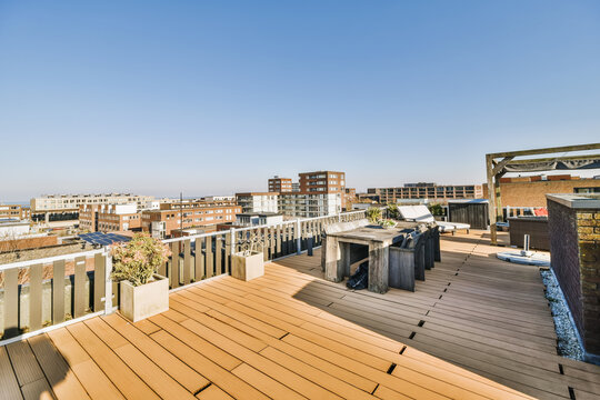 Fototapeta Dining zone on rooftop of residential building
